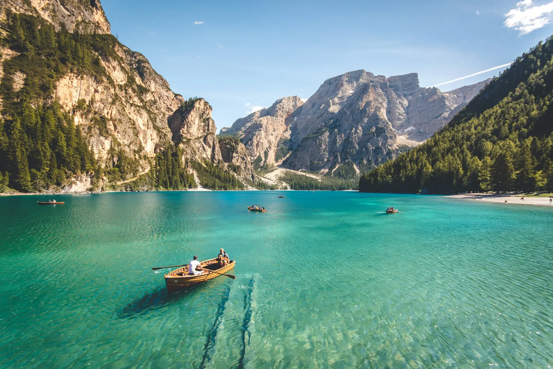 Turquoise alpine lake surrounded by mountains