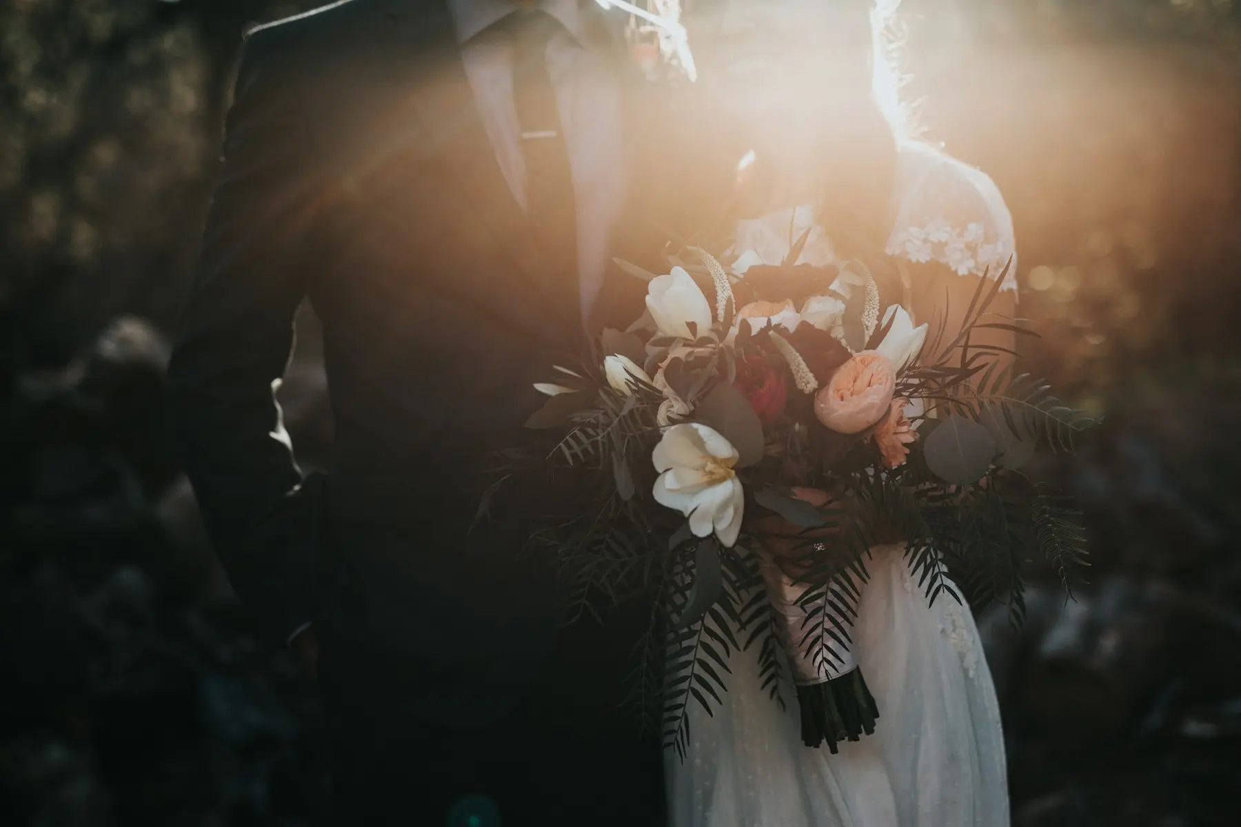 Bride holding a dark, moody bouquet