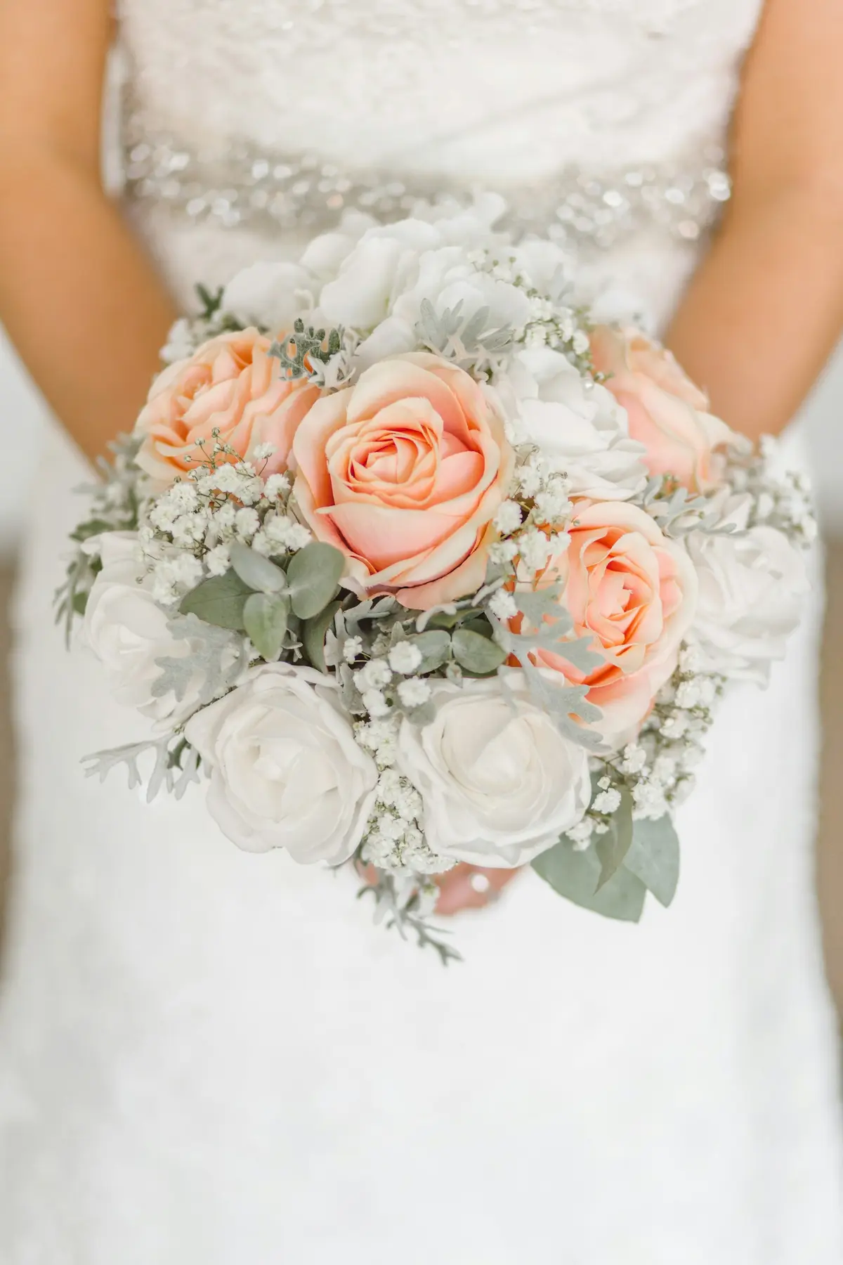 Bride holding a pastel bouquet