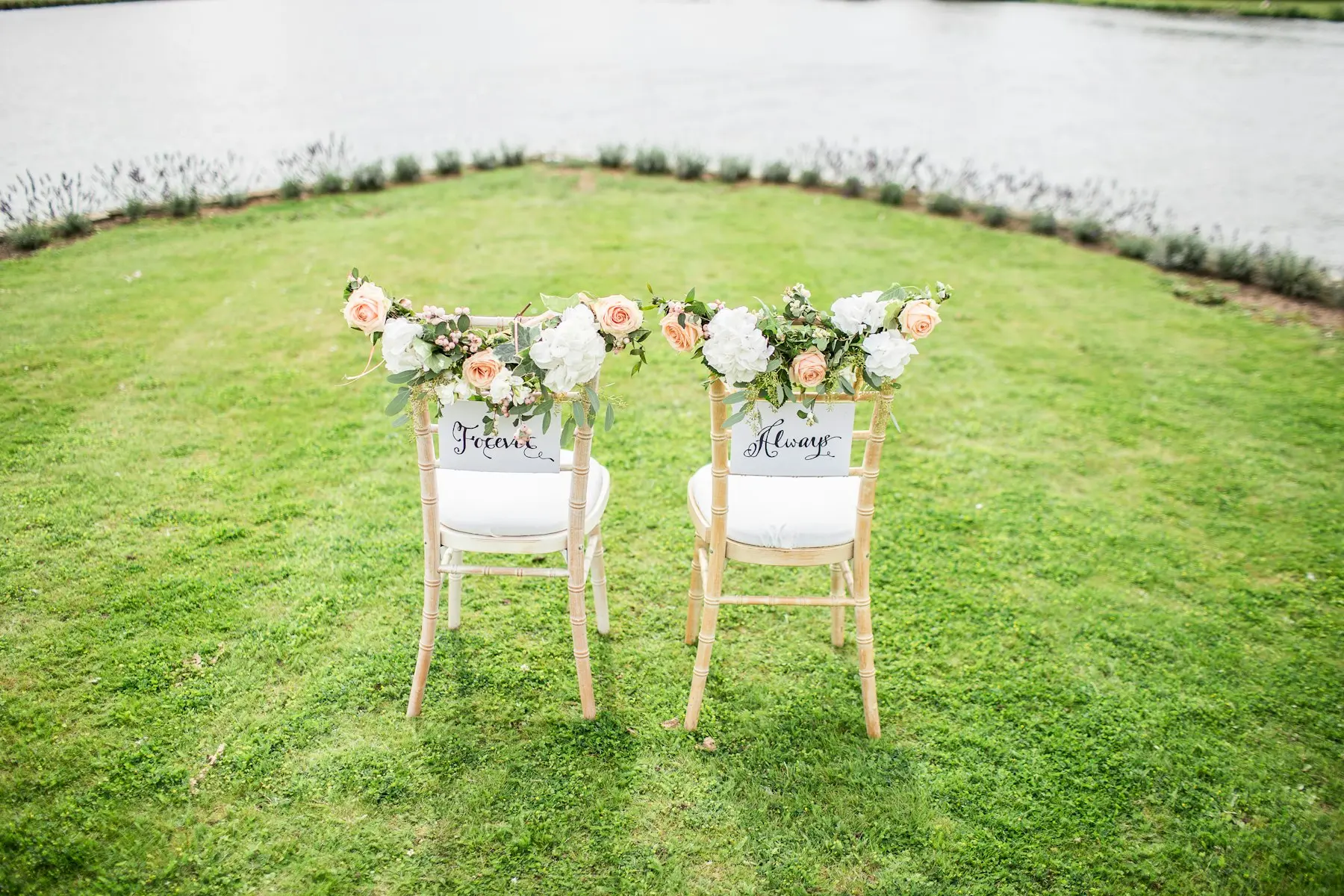 Decorated ceremony chairs on a lawn