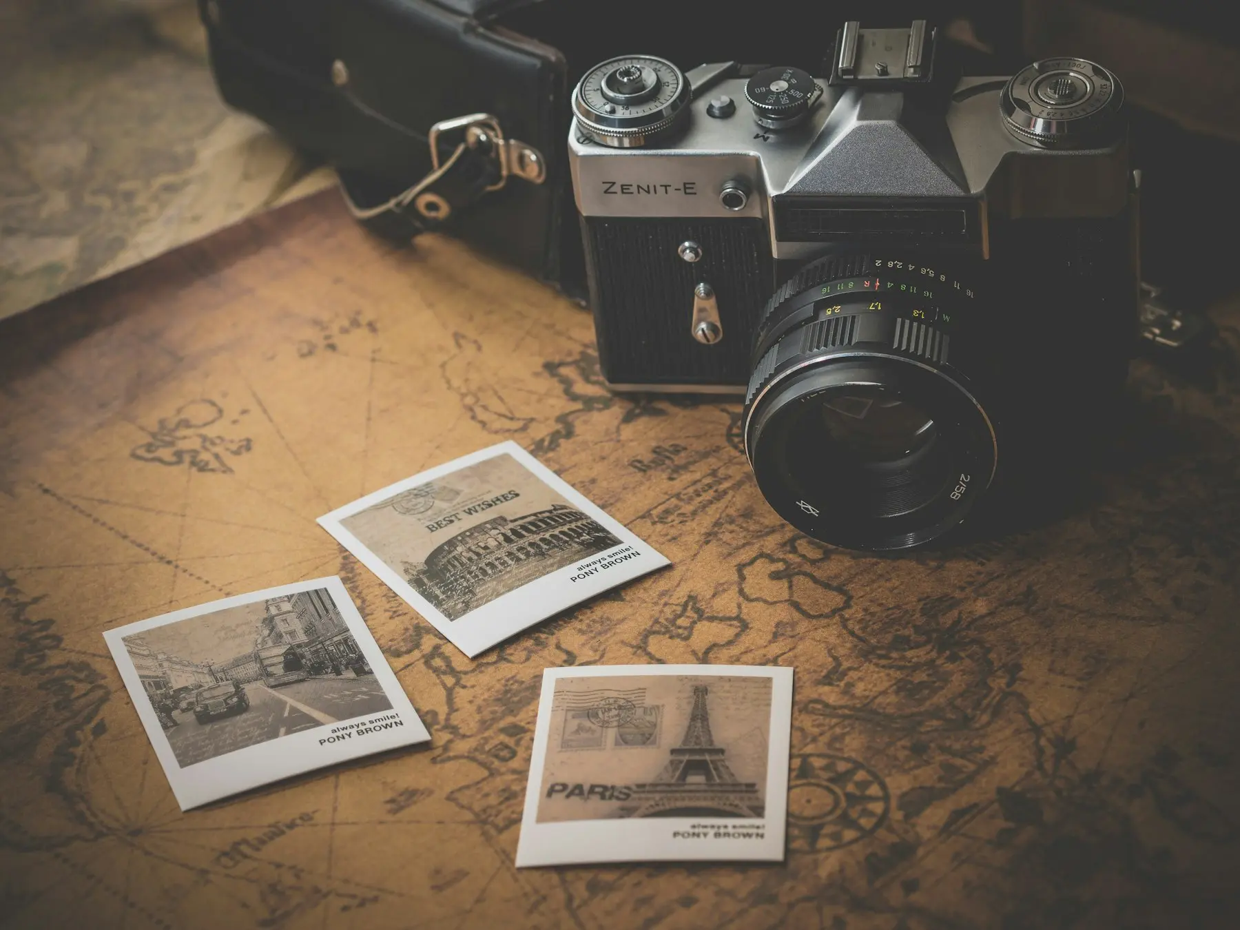 Vintage camera resting on a travel map